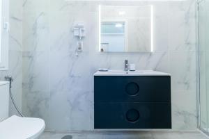 a bathroom with a sink and a mirror at Villa Amir in Fuengirola +147 photos