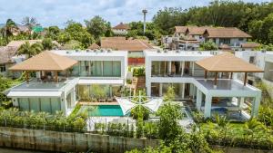 an aerial view of a house with a swimming pool at Akal Villa Phuket in Ban Thalat Choeng Thale