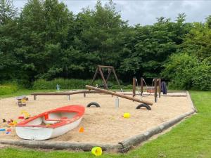 a playground with a boat in the sand at LF454-Vestervig-Hannesvej-24 in Vestervig