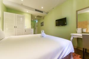 Ένα ή περισσότερα κρεβάτια σε δωμάτιο στο Lion King Hotel