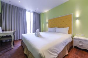 Ένα ή περισσότερα κρεβάτια σε δωμάτιο στο Lion King Hotel