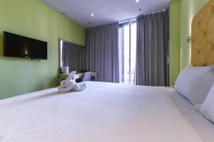 Ένα ή περισσότερα κρεβάτια σε δωμάτιο στο Lion King Hotel
