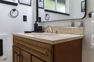 a bathroom with a sink and a mirror at Luxury Duplex Smart Toilet AC BBQ in University Place +41 photos