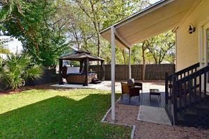 a backyard with a gazebo and a grill at Private Hot Tub - Walk to Pearl - Pet Friendly 3BR in San Antonio