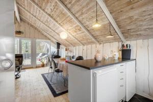 a kitchen with a counter top in a room at BV287-Blavand-Soren-Lassens-Vaenge-11 in Blåvand +13 photos