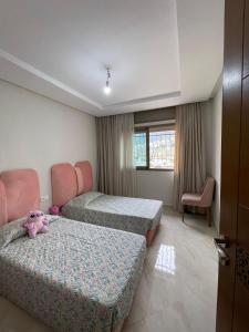 Giường trong phòng chung tại Boanan Mandar