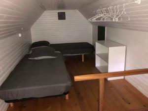 Ένα ή περισσότερα κρεβάτια σε δωμάτιο στο Chalet avec étang pleine nature