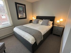 Voodi või voodid majutusasutuse Roseleigh Cottage in the Heart of Cookham toas