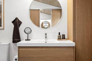 a bathroom with a sink and a mirror at 1093-ringkobing-Fyrrealle-3 in Ringkøbing +34 photos