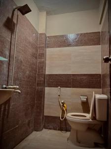 a bathroom with a toilet and a sink at 1-BHK Velvet Keys Executive Suite Near Clifton Beach in Karachi