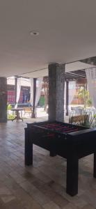 a pool table in the middle of a room at Búzios Beach Resort in Buzios