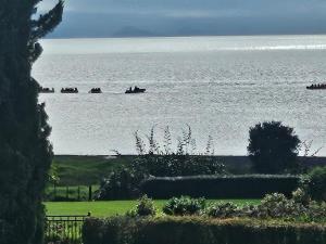 a large body of water with boats in it at Rainbow Rose in Orere Point +1 photo