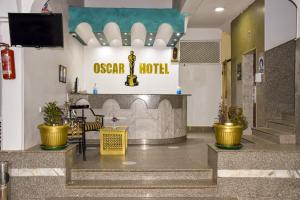 a lobby with a sign for the oscar hotel at Oscar Hotel Aswan 中國人之家 in Aswan