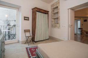 Posteľ alebo postele v izbe v ubytovaní Palazzo Degli Olivi