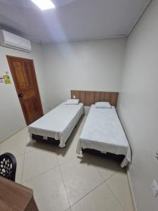 Ένα ή περισσότερα κρεβάτια σε δωμάτιο στο Hotel Akemi +5 φωτογραφίες