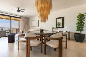 a dining room with a table and chairs at Luxury Pedregal Condo - Views, Pool & Concierge in Cabo San Lucas