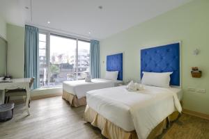 Ένα ή περισσότερα κρεβάτια σε δωμάτιο στο Lion King Hotel