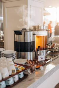 a kitchen with a coffee maker on a counter at Khatai Family Hotel & Restaurant in Baku