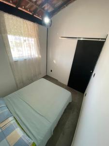 Ένα ή περισσότερα κρεβάτια σε δωμάτιο στο Apartmento com vista pro mar Praia das Dunas