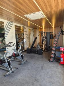 a gym with several treadmills and exercise bikes at Houze 208 in Asuncion