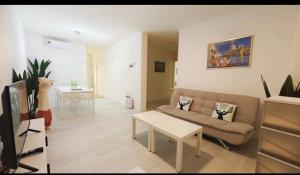 Posezení v ubytování Town city 3 Bedroom Apartment