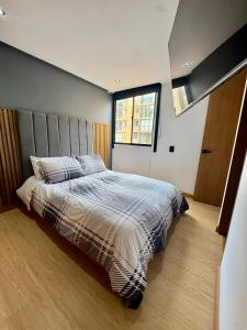Ένα ή περισσότερα κρεβάτια σε δωμάτιο στο Apartamento de Lujo frente al CC Viva