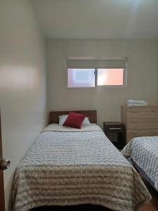 Postel nebo postele na pokoji v ubytování Departamento full equipado en Coyhaique