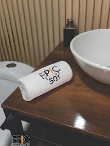 a roll of toilet paper sitting on a table next to a sink at Epic Suite 501 Deluxe Aeropuerto in Cuba +21 photos