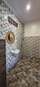 a bathroom with a sink and a mirror at Lavista Guesthouse in Ubud +24 photos