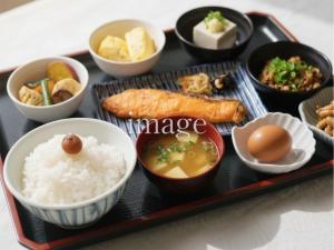 a tray of food with rice and eggs and other foods at APA Hotel Takasakieki Higashiguchi in Takasaki +50 photos