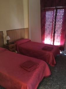 Postel nebo postele na pokoji v ubytování Hostal L'Escaleta