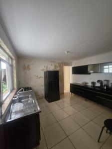 Η κουζίνα ή μικρή κουζίνα στο Aurora três