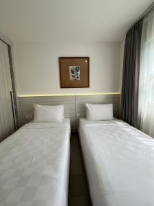 Ένα ή περισσότερα κρεβάτια σε δωμάτιο στο Artha Villa Pererenan By Fays Hospitality