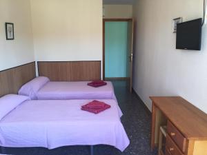 Postel nebo postele na pokoji v ubytování Hostal L'Escaleta