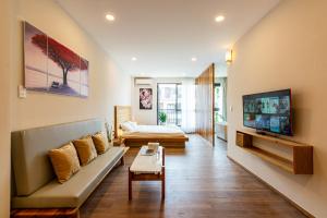 TV a/nebo společenská místnost v ubytování Coast Pearl Hotel & Apartment - Free Airport PickUp