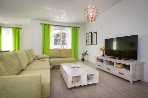 TV a/nebo společenská místnost v ubytování Apartments Tamburini