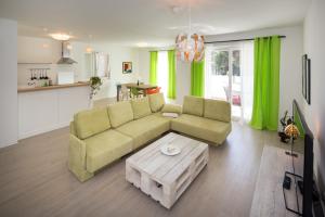 TV a/nebo společenská místnost v ubytování Apartments Tamburini