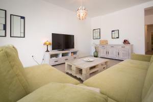 TV a/nebo společenská místnost v ubytování Apartments Tamburini