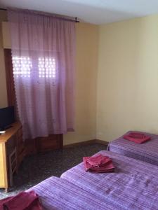 Postel nebo postele na pokoji v ubytování Hostal L'Escaleta