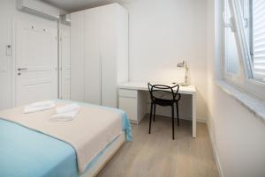 Postel nebo postele na pokoji v ubytování Apartments Tamburini