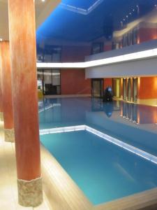 a large swimming pool in a large building at Blüemlisalp 712 Studio in Beatenberg