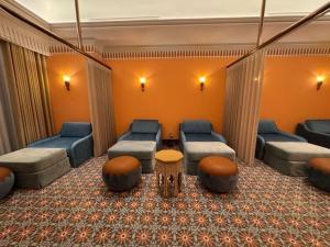 a waiting room with couches and chairs and a table at Hôtel de l'Amour Tam Đảo in Tam Ðảo