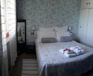 A bed or beds in a room at B&B L'Albero Di Antonia