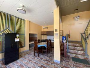 a dining room and kitchen with a table and chairs at Jean Apartelle in Loon
