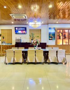 a conference room with a long table and chairs at Êm Villa 8 Bedrooms with Swimming Pool in Hue