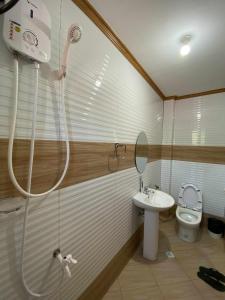 a bathroom with a shower and a sink and a toilet at Jean Apartelle in Loon