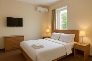 Ένα ή περισσότερα κρεβάτια σε δωμάτιο στο Luxy 3BHK Bungalow in Goa