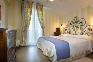Posteľ alebo postele v izbe v ubytovaní Hotel Serenella