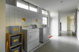 a laundry room with washers and dryers in it at Hotel Ever Spring - Penghu in Magong