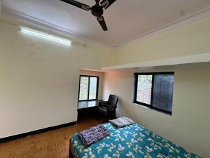 Ένα ή περισσότερα κρεβάτια σε δωμάτιο στο Aagatya HomeStay +10 φωτογραφίες